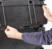 close up of a man opening the front lid of a explorer 5140 tool case