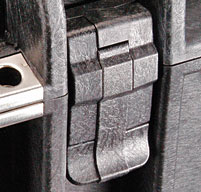 Close up of a black peli case showing the easy-open double throw latches