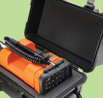close up of an open peli 1460 case with an orange measuring equipment inside
